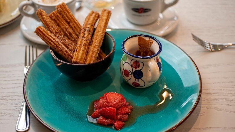 Churro dessert with side of strawberries